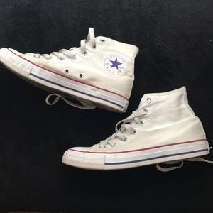 High top white Converse shoes
